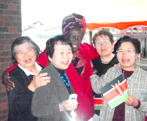 Miriam Were with Fukushima grandmothers, like herself, who she requested to meet on the visit to Noguchi’s birthplace in Fukushima. They came to meet the bullet train on arrival.