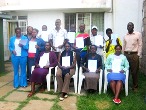 UZIMA Youth with certificates after training in business skills